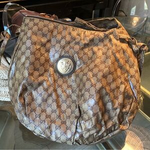 Authentic Gucci patent logo bag.